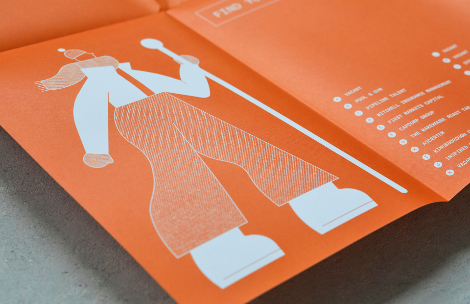 Close up of illustrated character in orange brochure.