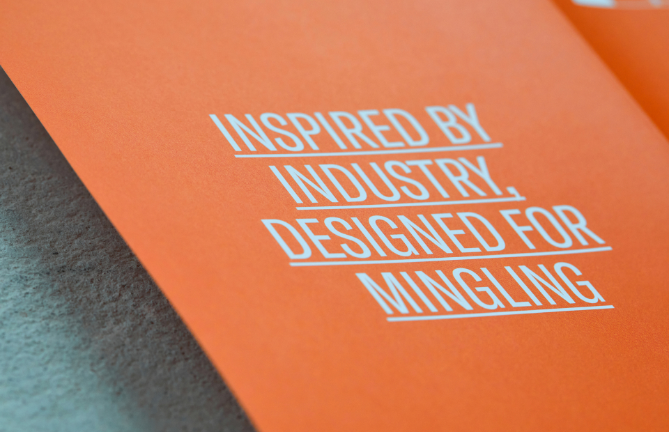 Close up of text printed in brochure on orange background.