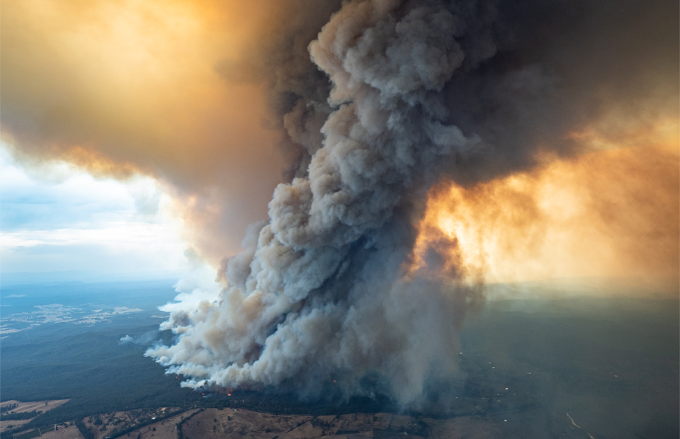 Photo of smoke tornado from large bushfire, photo taken from helicopter looking down.