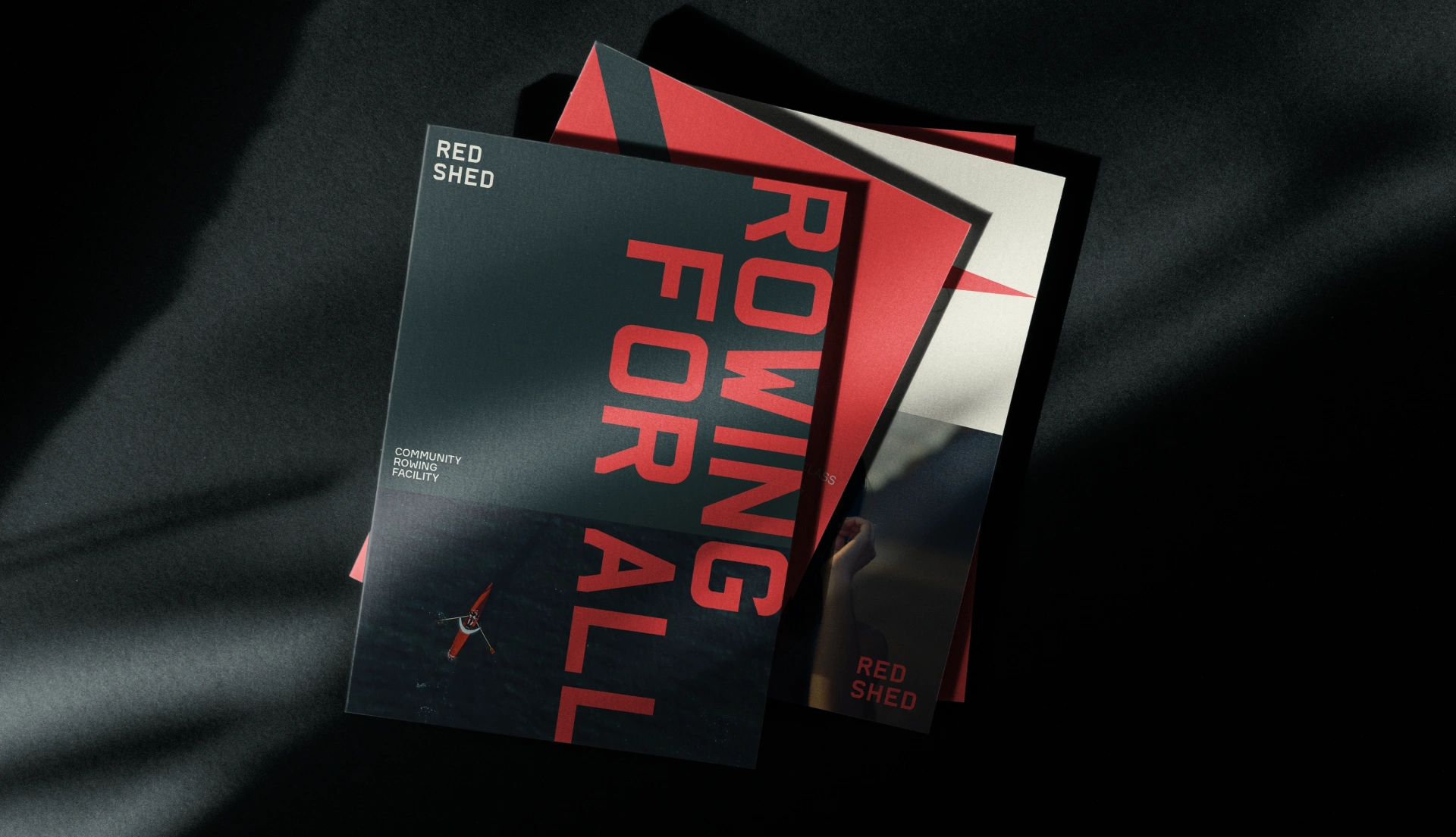 Pile of booklets with the Red Shed branding applied